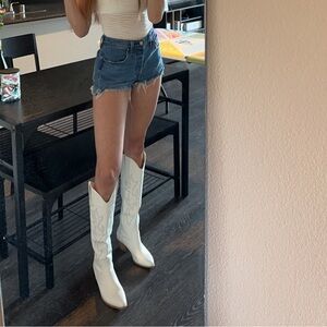 White knee high boots